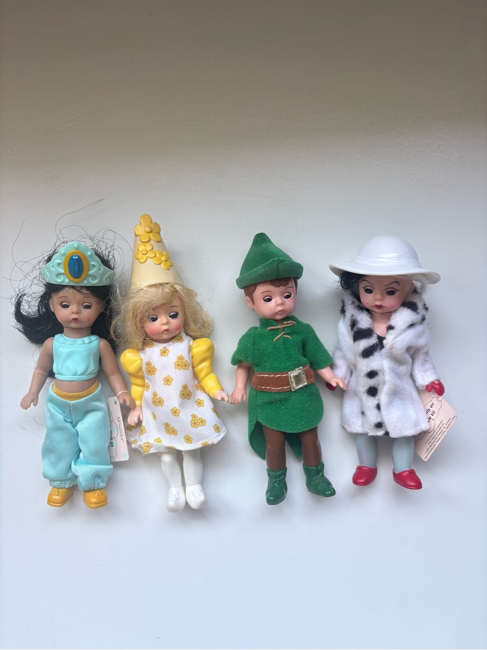 Madame Alexander dolls Jasmine, Darling, Peter Pan, and Cruella de Vil